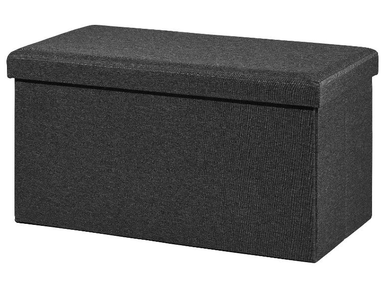 Banc de rangement pliable gris foncé en tissu texturé.