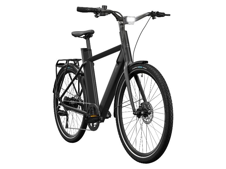 Un vélo électrique noir avec des pneus Schwalbe.