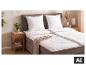 Oreillers et couette LIVARNO home sur un lit douillet. [image générée par l'IA]