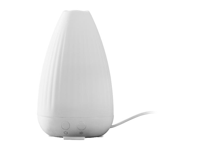 Diffuseur d'arômes ultrasonique blanc avec deux boutons de commande et un cordon d'alimentation.