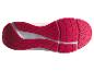 Semelle de chaussure de sport avec motif de crampons rouges et détails blancs.