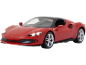 Voiture de sport rouge miniature avec phares allumés