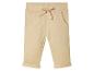 Pantalon beige avec cordon de serrage et poches.