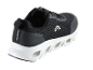 Chaussures de sport noires Crivit avec semelle blanche.