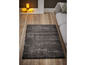 Un tapis gris foncé dans un salon moderne.