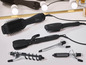 Un ensemble de différents outils de coiffage de la marque Diva, comprenant un sèche-cheveux brosse, un lisseur et un fer à friser.