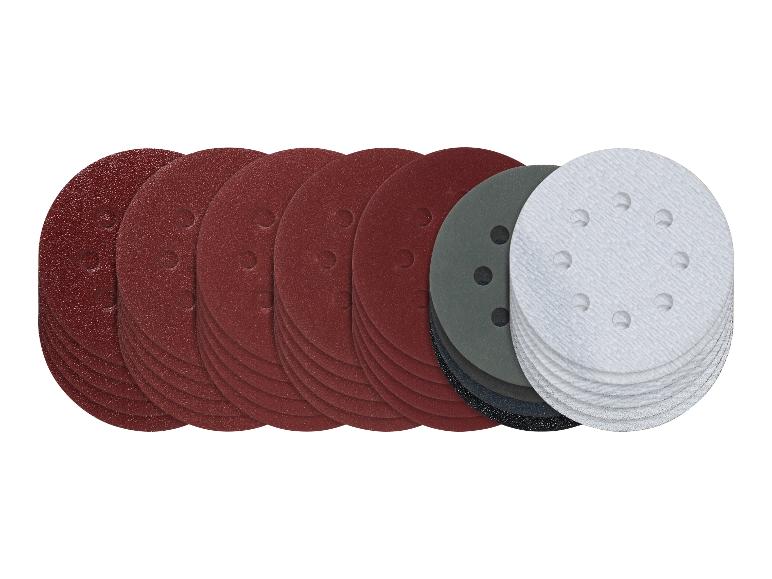 Assortiment de disques de ponçage ronds de différents grains et couleurs, dont rouge, gris et blanc.