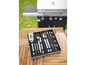Ensemble d'ustensiles de barbecue avec spatule, brosse et fourchette dans un coffret en aluminium.