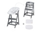 Une chaise haute Stokke Tripp Trapp grise avec un siège capitonné blanc et deux coussins supplémentaires.