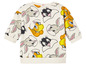 Un t-shirt blanc avec un motif Bugs Bunny, Tweety et Sylvestre.