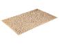 Tapis de bain beige à texture douce.