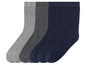Trois paires de chaussettes grises et bleu foncé.