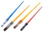 Quatre sabres laser Star Wars, dont R2-D2, Chewbacca et Dark Vador.
