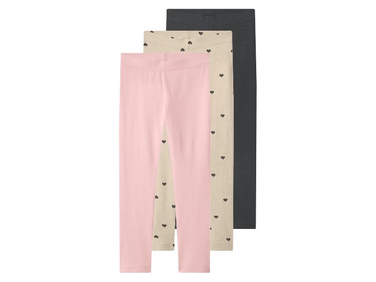 Lot de 3 leggings fille : rose, beige à cœurs et gris foncé.