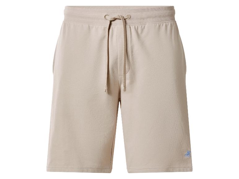 Short de survêtement beige avec cordon de serrage ajustable et petit logo brodé.