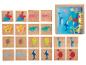 Puzzle en bois avec des images d'animaux marins, y compris des baleines, des requins, des crabes et des tortues.