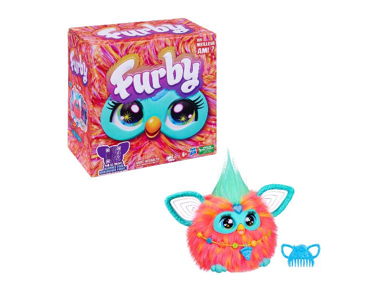 Jouet interactif Furby dans et hors de la boîte, avec un peigne.