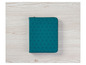 Un portefeuille en cuir teal avec un motif géométrique.