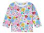 Un t-shirt blanc à manches longues pour bébé avec un motif floral joyeux.