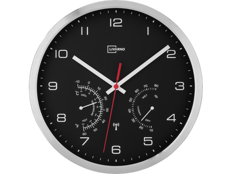 Horloge murale avec thermomètre et hygromètre, noire avec bordure argentée.