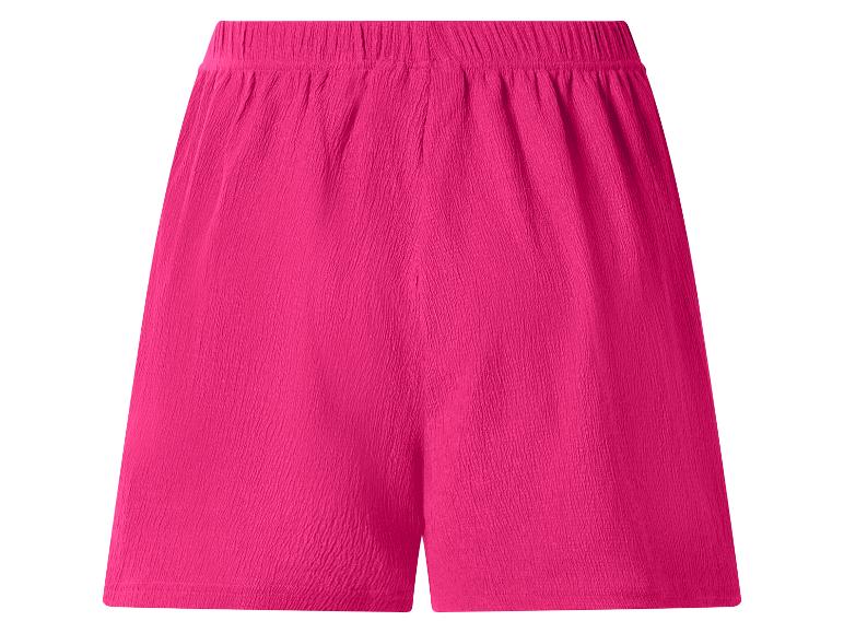 Short femme fuchsia avec taille élastique et texture froissée.