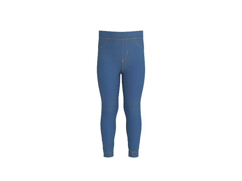 Jegging bleu avec surpiqûres oranges.