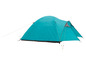 Une tente turquoise avec un fond gris foncé.