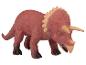 Un jouet de dinosaure en plastique rouge, un Triceratops.