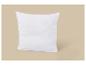 Oreiller blanc sur fond beige