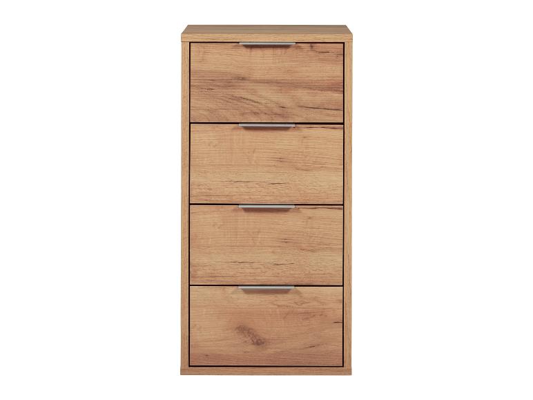 Une commode en bois avec quatre tiroirs.