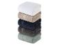 Serviettes de bain empilées : blanc, beige, bleu marine, gris anthracite et vert sauge.
