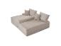 Canapé modulaire beige deux pièces avec coussins, texture velours côtelé.