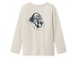 T-shirt à manches longues beige avec un imprimé de tigre portant des écouteurs.