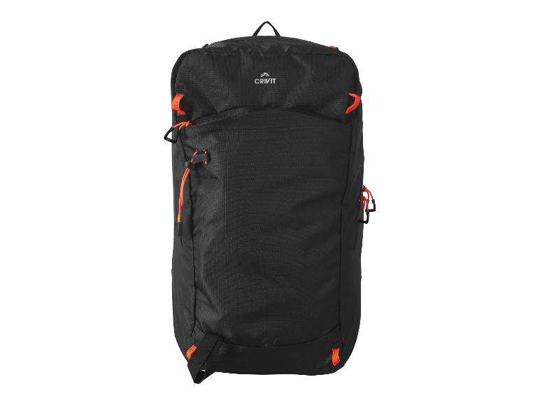 Sac à dos Crivit noir avec détails orange et logo.