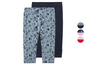 Deux leggings pour filles, l'un à imprimé coquillages et l'autre uni bleu foncé.