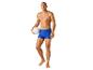 Maillot de bain bleu et ballon de volley.