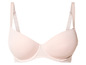 Un soutien-gorge rose clair avec des bretelles larges.
