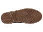 La semelle d'une sneaker marron avec un motif épais.