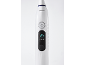 Brosse à dents électrique blanche avec bouton d'alimentation et mode massage éclairé.