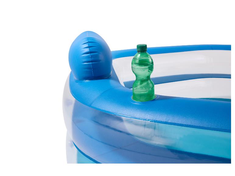 Piscine gonflable avec une bouteille verte dans un porte-gobelet intégré.
