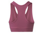 Un soutien-gorge de sport rose pour femme.