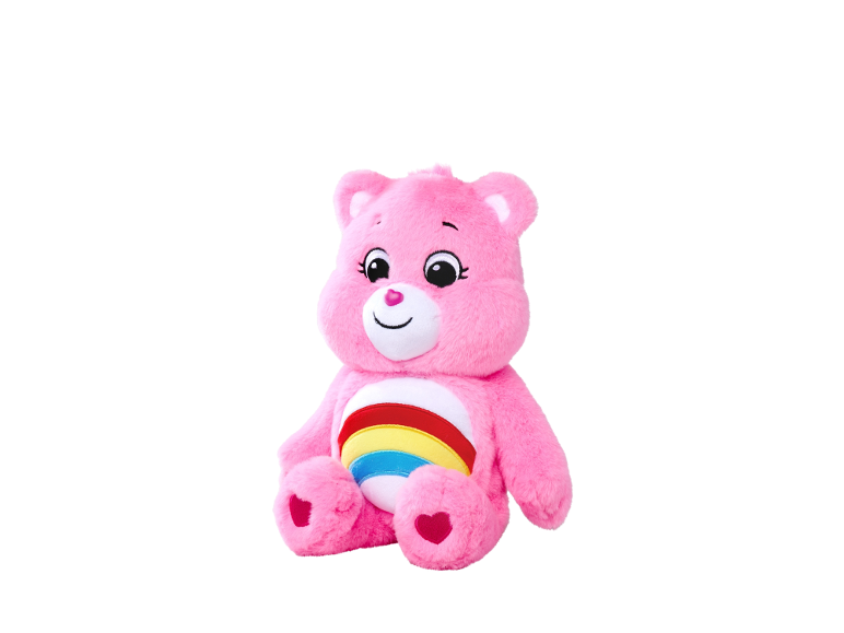 Ours en peluche rose avec un arc-en-ciel sur le ventre.