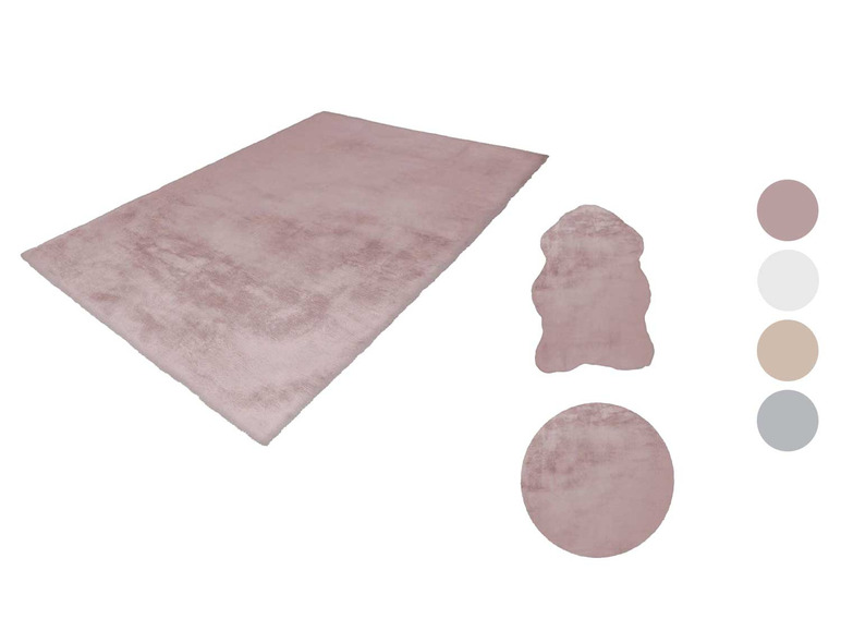 Un tapis rose, un tapis rond et un tapis en fausse fourrure.