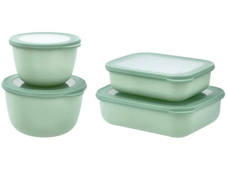 Ensemble de boîtes de conservation vertes: deux rectangulaires et deux rondes.