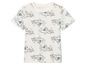 Un t-shirt blanc avec un motif d'avions.