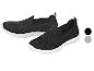 Chaussures de sport slip-on noires pour femmes avec semelles blanches, également disponibles en gris.