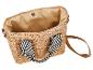 Sac en paille avec doublure en tissu beige, anse rayée noir et blanc et bandoulière marron.