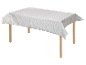 Nappe à motifs géométriques sur une table en bois.