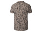 Chemise beige à manches courtes avec un imprimé abstrait.