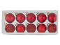 Boules de Noël rouges brillantes et pailletées dans une boîte transparente.